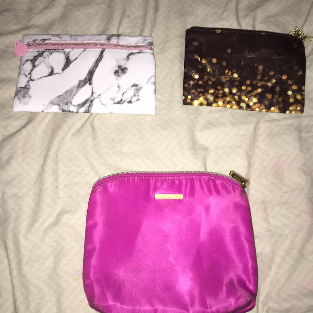 Three makeup bags.